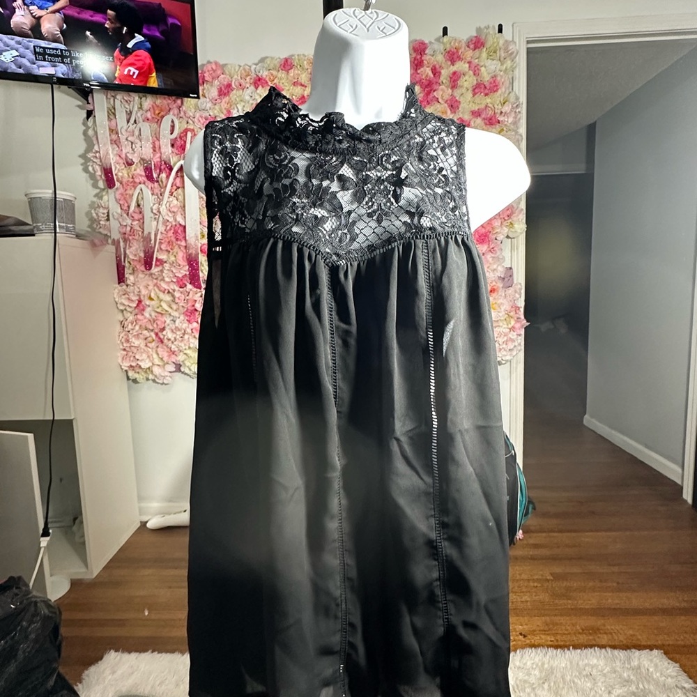 Short sleeve lace top. Has a A-line flow